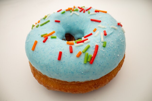 Junk food concept - big donut with blue glaze