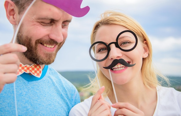 Just for fun humor and laugh concept couple posing with party\
props sky background photo booth props man with beard and woman\
having fun party add some fun making funny photos birthday\
party