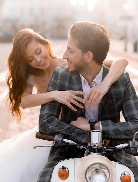 Just married couple on retro vehicle