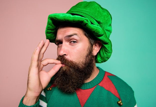 Just perfect Christmas elf Elf concept Happy celebration Bearded elf Winter carnival St Patricks day Hipster with beard wearing green party costume excellent Cheerful man celebrate holiday