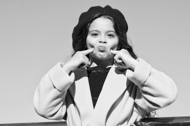 Just playing enjoy autumn day lucky with weather funny little lady small girl outdoor french style kid fashion stylish girl child after hairdresser she has unreal curly hair trip to france