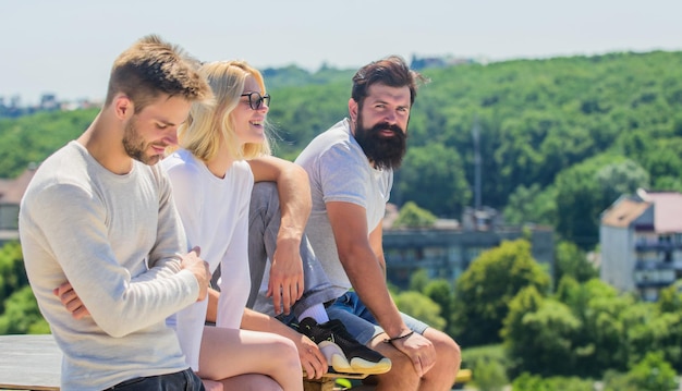 Just relax best friends Summer vacation group of four people great fit for day off Group of people in casual wear diverse young people talking together happy men and girl relax