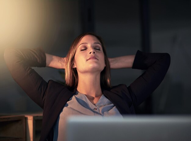 Just resting my eyes for a second Shot of a young designer leaning back in her chair with her eyes closed