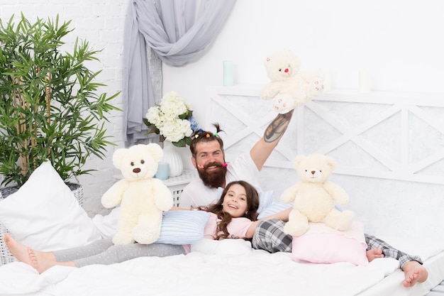 Just smile i love my daddy happy morning together good night funny pajama party small girl with bearded father in bed weekend at home father and daughter having fun family bonding time