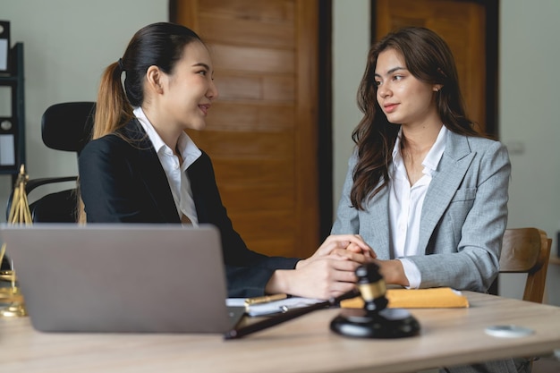 Photo justice and attorney concept lawyer meeting and consoling solution to his client provide legal advice and trust commitment strain serious for problem