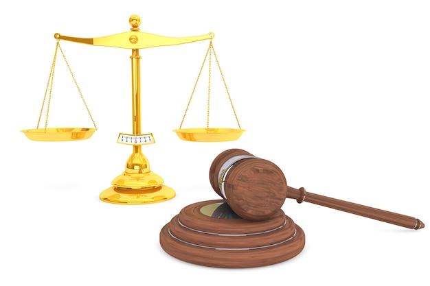 Justice gold scale and wooden gavel on a white background