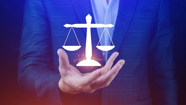 justice and law concept legal advice businessman holding scales digital hologram labor law sign labor law lawyer legal business