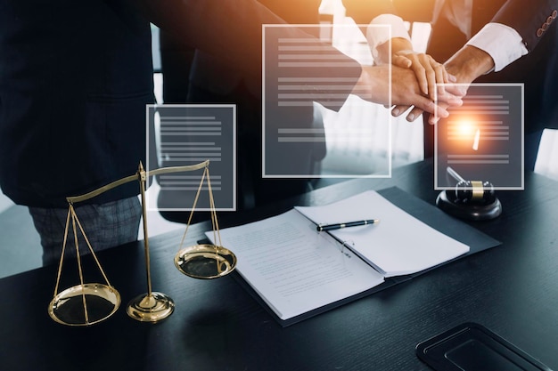 Justice and law conceptMale judge in a courtroom with the gavel working with computer and docking keyboard eyeglasses on table in morning light