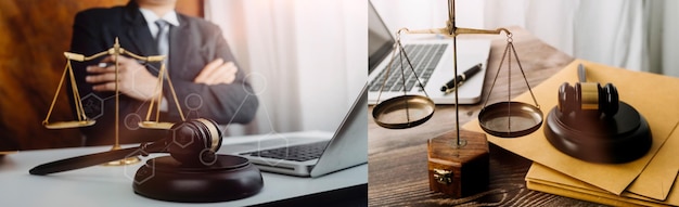 Justice and law conceptMale judge in a courtroom with the gavel working with computer and docking keyboard eyeglasses on table in morning light