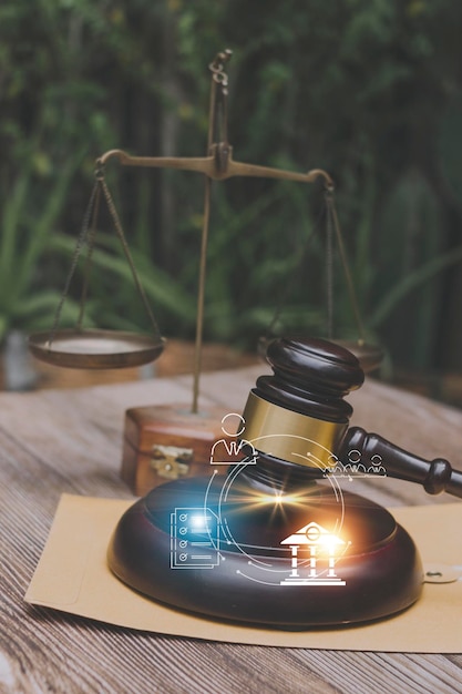 Justice and law conceptMale judge in a courtroom with the gavel working with computer and docking keyboard eyeglasses on table in morning light