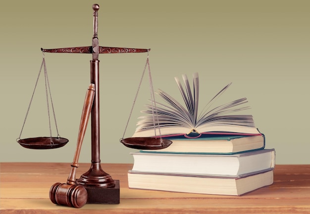 Justice Scales and books and gavel on wooden table