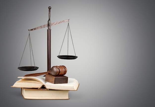 Justice Scales and books and wooden gavel on table. Justice concept