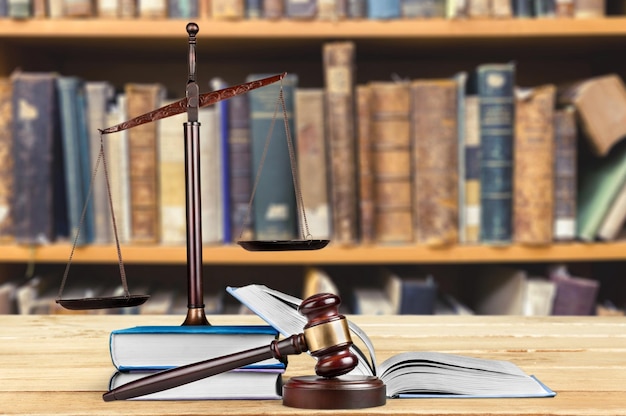 Justice Scales and books and wooden gavel on table. Justice concept