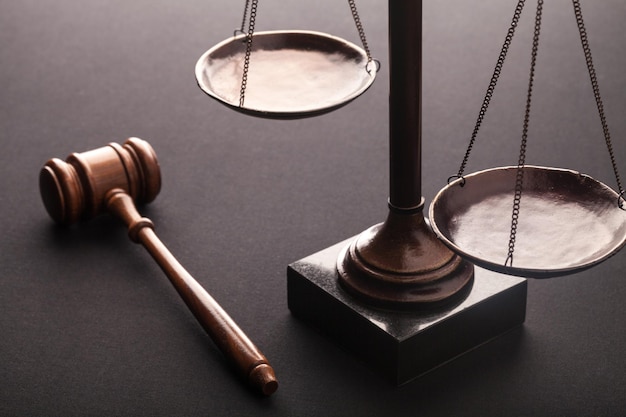 Justice Scales and wooden gavel on table