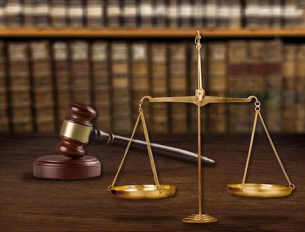 Justice Scales and wooden gavel on table