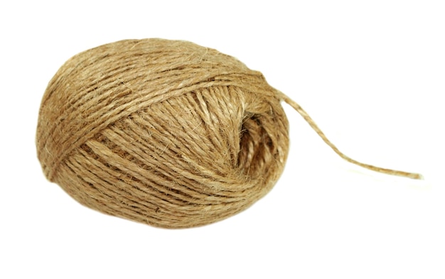 A jute ball with a loose thread on a white background