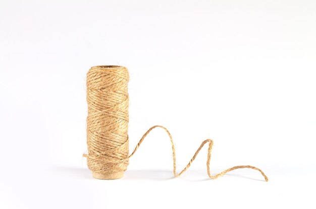 https://img.freepik.com/premium-photo/jute-twine-rope-skein-isolated-white-background_224798-1886.jpg?size=626&ext=jpg