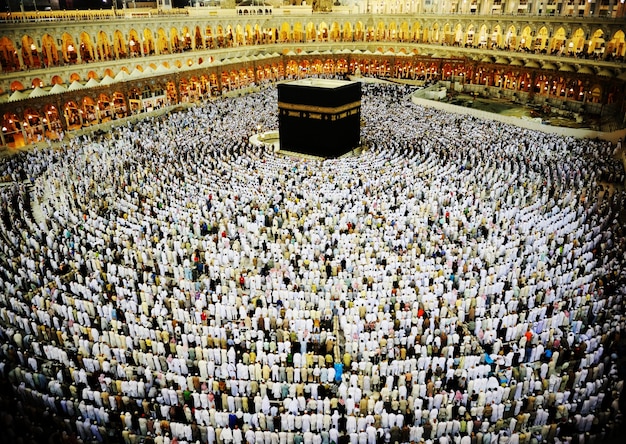 Kaaba in Mecca, Muslim people praying together at holy place