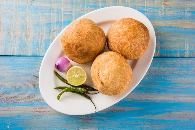 Kachori is a spicy snack from India also spelled as kachauri and kachodi. Served with tomato ketchup. Selective focus