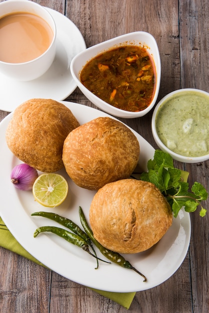 Kachori is a spicy snack from India also spelled as kachauri and kachodi. Served with tomato ketchup. Selective focus