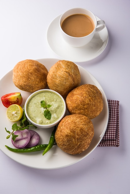 Kachori is a spicy snack from India also spelled as kachauri and kachodi. Served with tomato ketchup. Selective focus