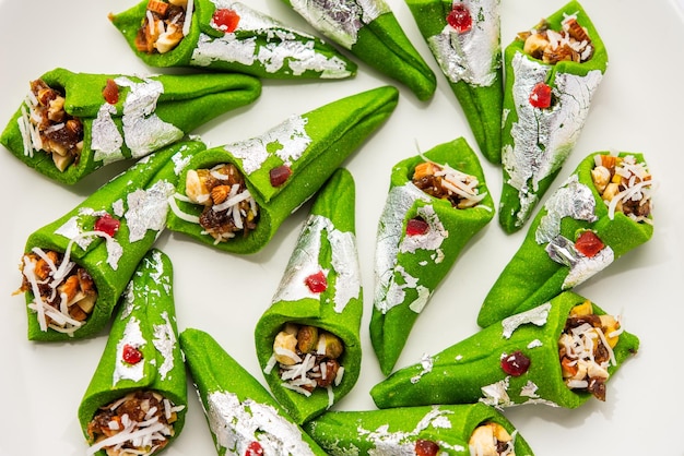 Kaju Gulkand Paan Mithai barfi Indian sweet or dessert served in a plate