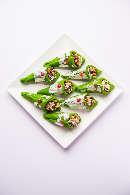 Kaju Gulkand Paan Mithai barfi Indian sweet or dessert served in a plate