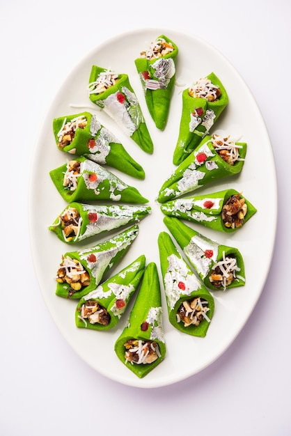 Kaju Gulkand Paan Mithai barfi Indian sweet or dessert served in a plate