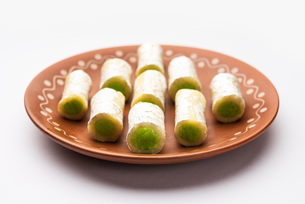 Kaju Pista Roll Or Cashew Pistachio Rolls Mithai or sigar Indian sweet or dessert for festivals