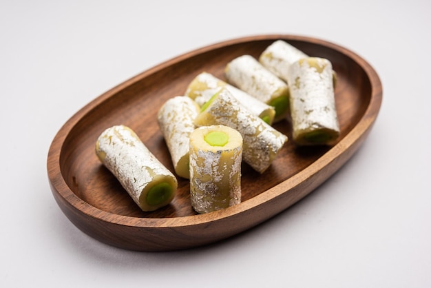 Kaju pista roll or cashew pistachio rolls mithai or sigar\
indian sweet or dessert for festivals