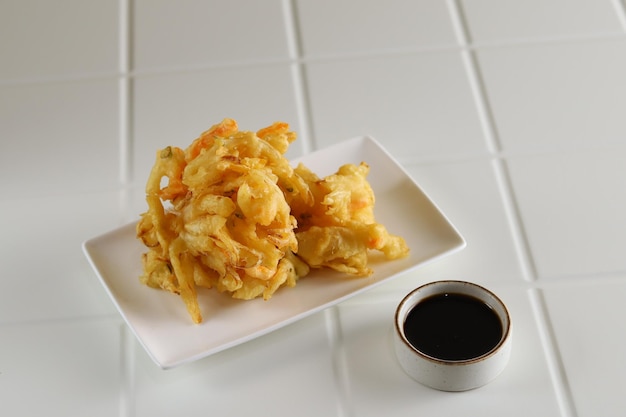 Kakiage tempura, Deep-fried vegetables served in white plate.