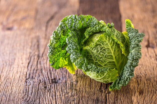 Kale  Fresh kale on rustic oak table.