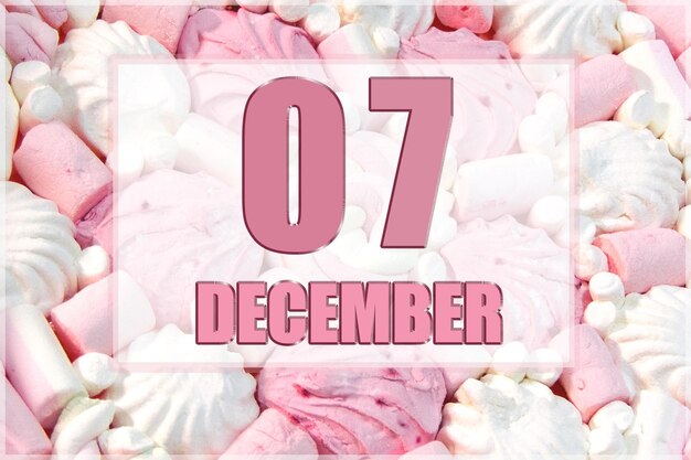 Kalenderdatum op de achtergrond van witte en roze marshmallows 7 december is de zevende dag van de maand