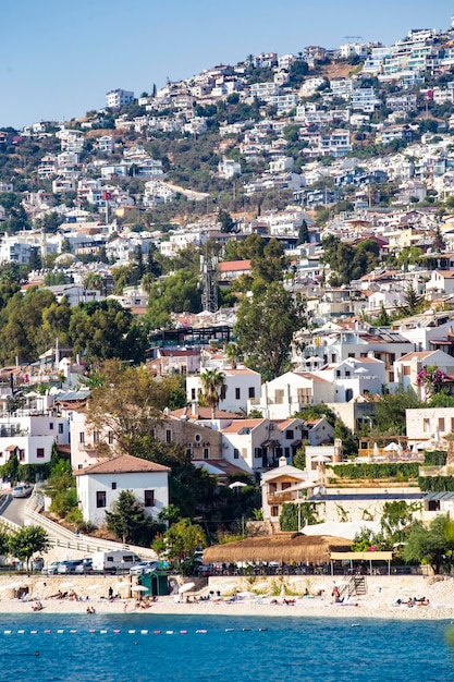 Photo kalkan small coastal town in antalya province, view from the boat, kalkan, turkey