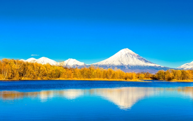 Kamchatka,Koriakski volcano in autumn evening with reflection on the lake