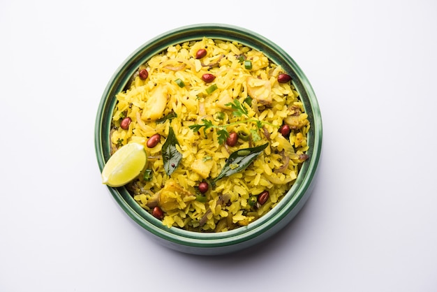 Photo kande pohe or aloo poha is a popular indian breakfast recipe made using flattened rice, usually served with hot tea