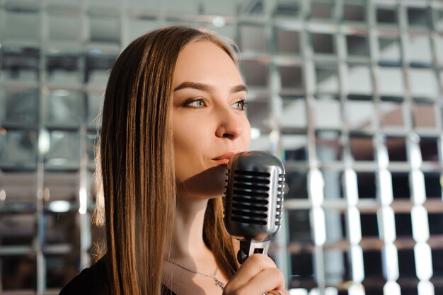 Karaoke party, Beauty girl with a microphone singing