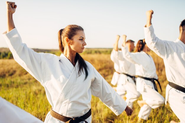 Karate group with master in white kimono