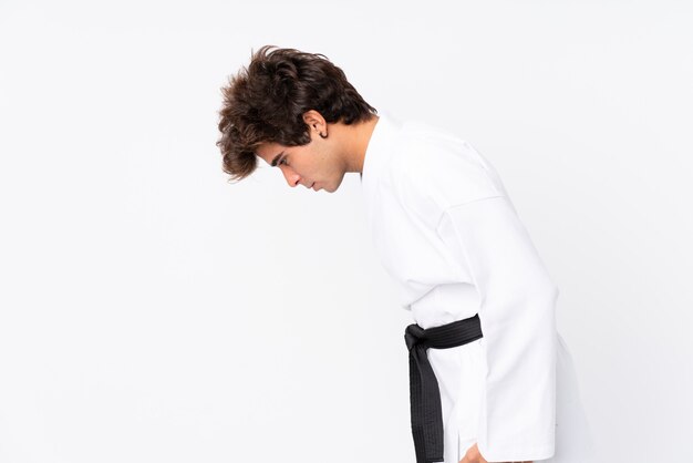 Karate man over isolated white wall