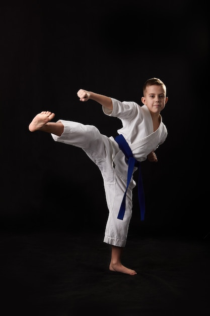 A karate player makes a kick