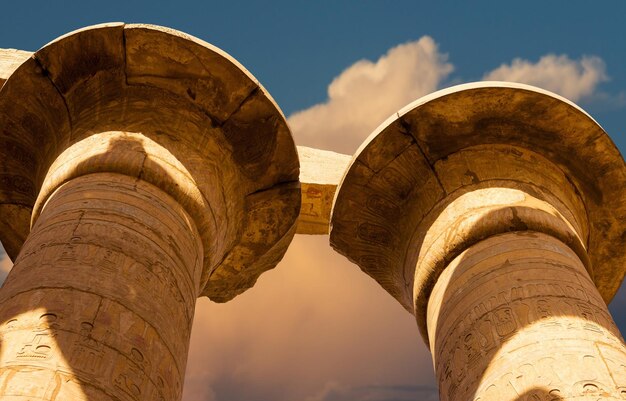 Karnak Temple Colossal sculptures of ancient Egypt in the Nile Valley in Luxor Embossed hieroglyphs on the wall