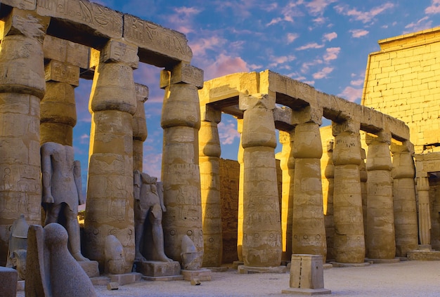 Karnak Temple Colossal sculptures of ancient Egypt in the Nile Valley in Luxor Embossed hieroglyphs on the wallx9