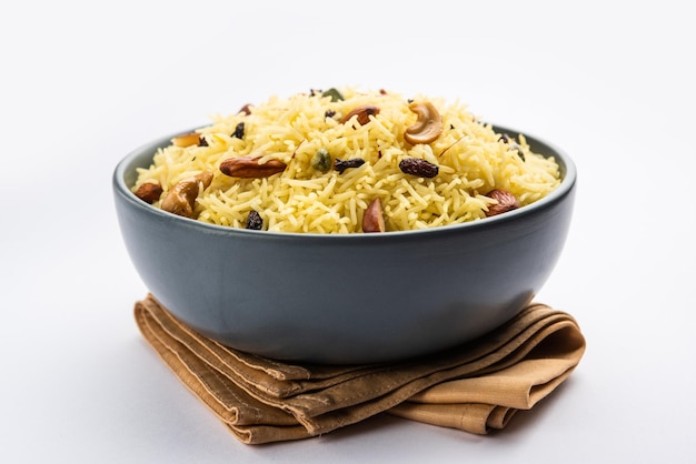 Kashmiri sweet modur pulao made of rice cooked with sugar water flavored with Saffron and dry fruits