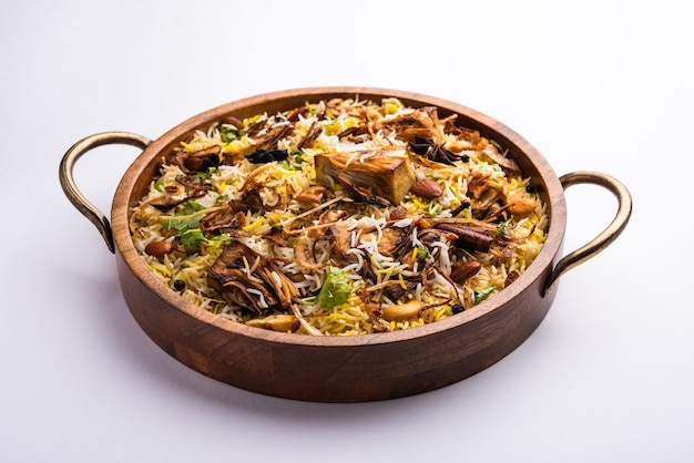 Kathal Biryani is made using raw jackfruit pieces cooked slowly with a variety of spices and mixed with basmati rice. served with curd and salan. Indian vegetarian food