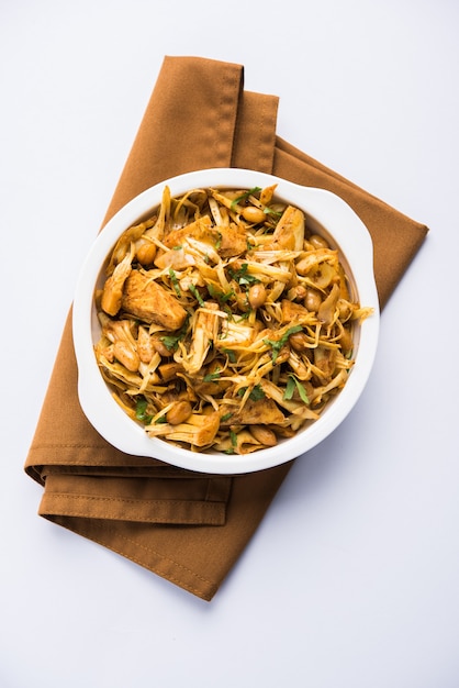 Kathal, Fanas ki Sukhi Sabzi or Bhaji known as  Spicy Jackfruit dry Vegetable recipe, served in a white bowl over moody background. Selective focus