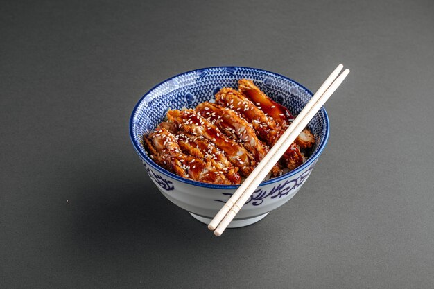 Katsudon fried chicken with rice in a bowl