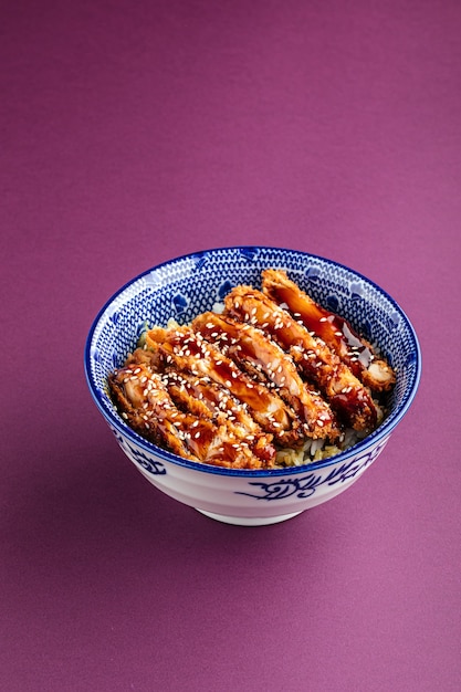 Katsudon fried chicken with rice in a bowl