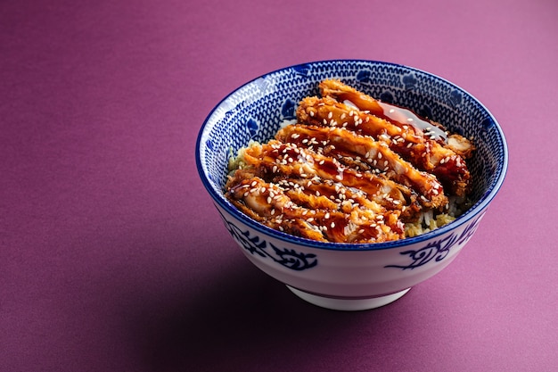 Katsudon fried chicken with rice in a bowl