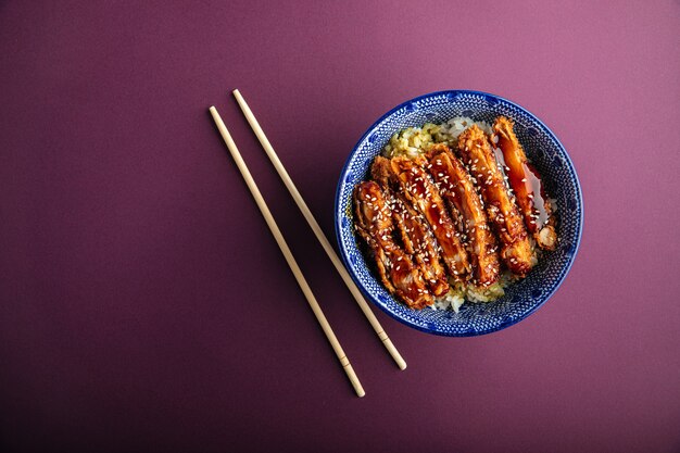 Katsudon fried chicken with rice in a bowl