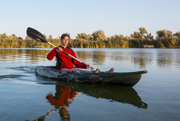 Kayaking in river in the summer season